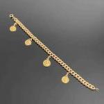 BRACELET en or jaune maille gourmette (creuse) retenant quatre petites...