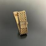 MONTRE-BRACELET de dame en or jaune. Bracelet maille souple type...