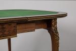 François LINKE (1855-1946). TABLE A JEU formant CONSOLE de forme...