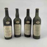 4 bouteilles POMEROL - 1957. Etiquettes tachées, niveaux basses épaule/...